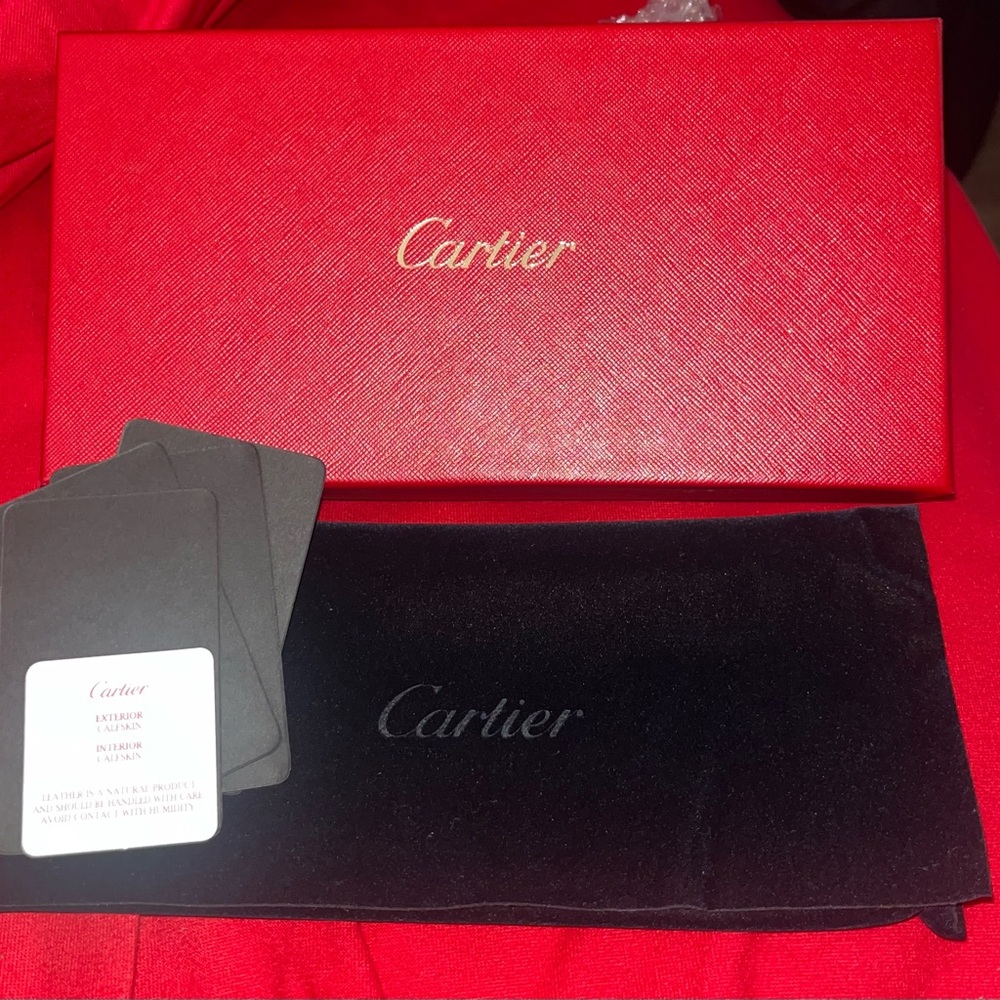 Cartier Black Pouch on Red Background